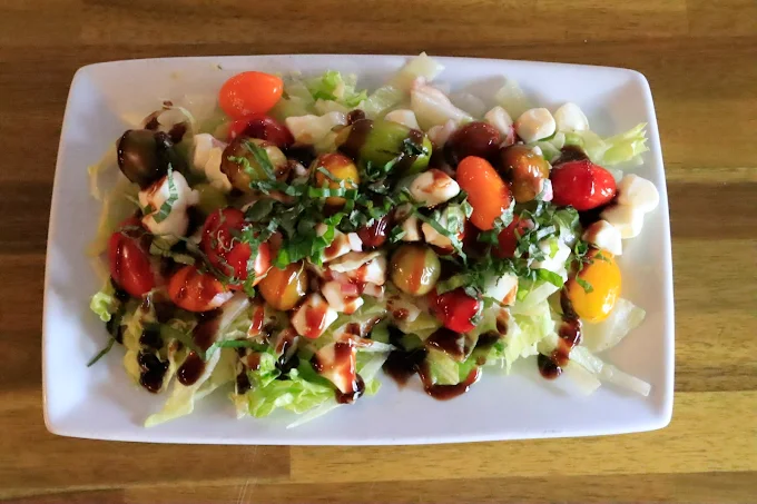 Caprese salad drizzled with balsamic