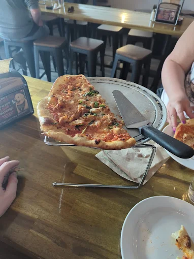 Pizza slice on a white plate