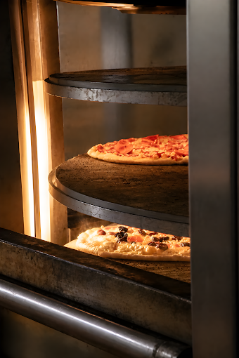 Pizzas baking in the oven